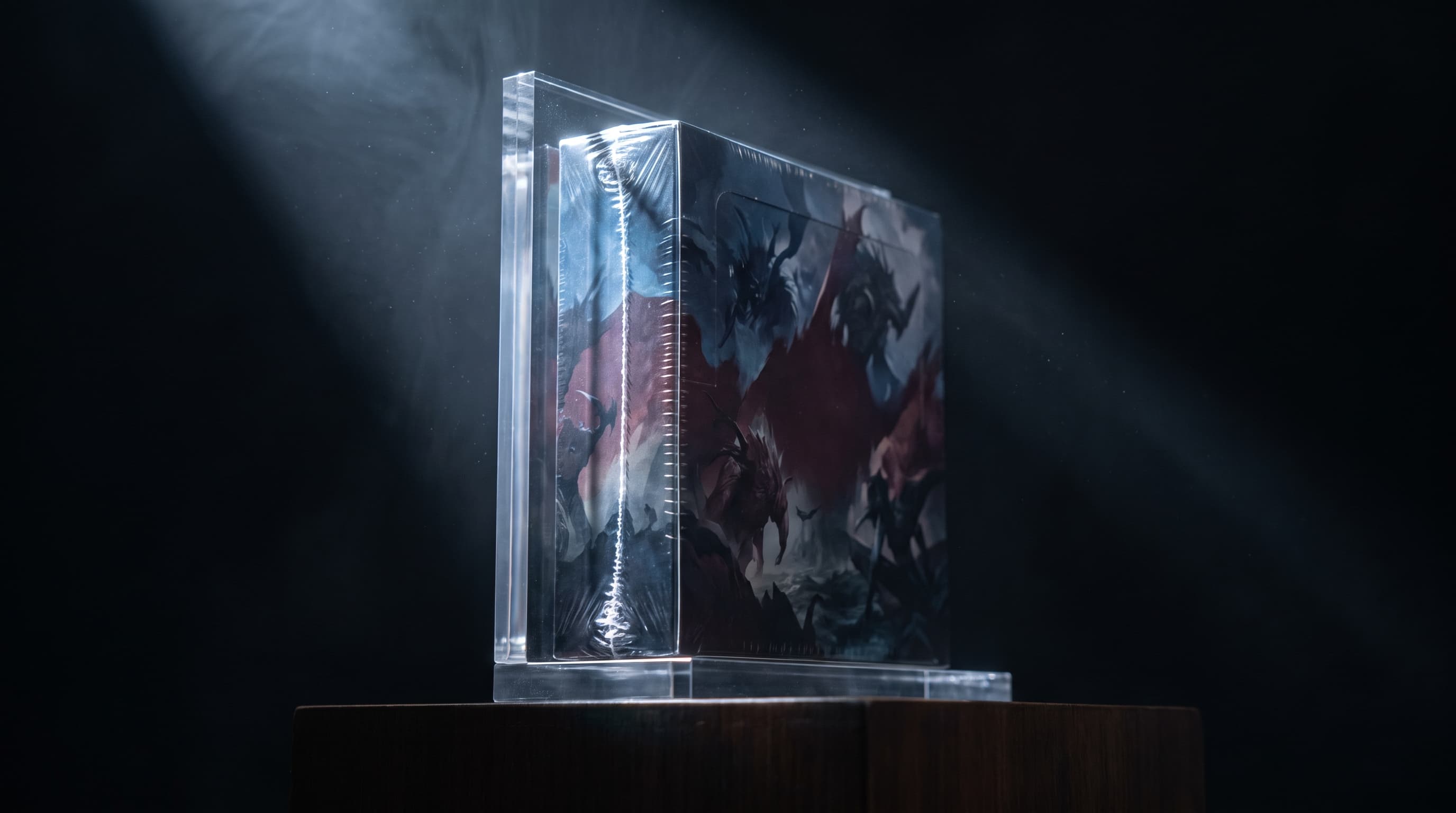 A sealed hobby box in a display stand, lit by a single hard spotlight against a near-black background with dust motes visible in the beam.